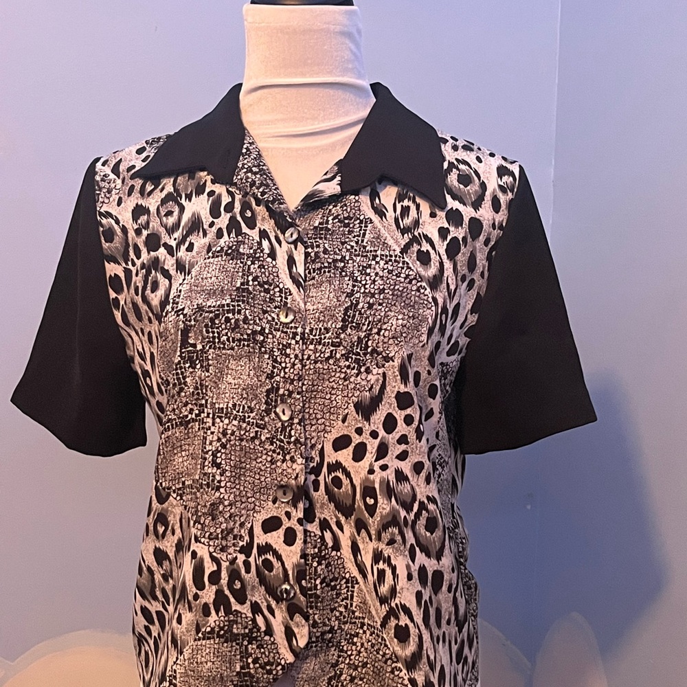 Stacey short sleeve button up blouse. Animal print with black shirt sleeves